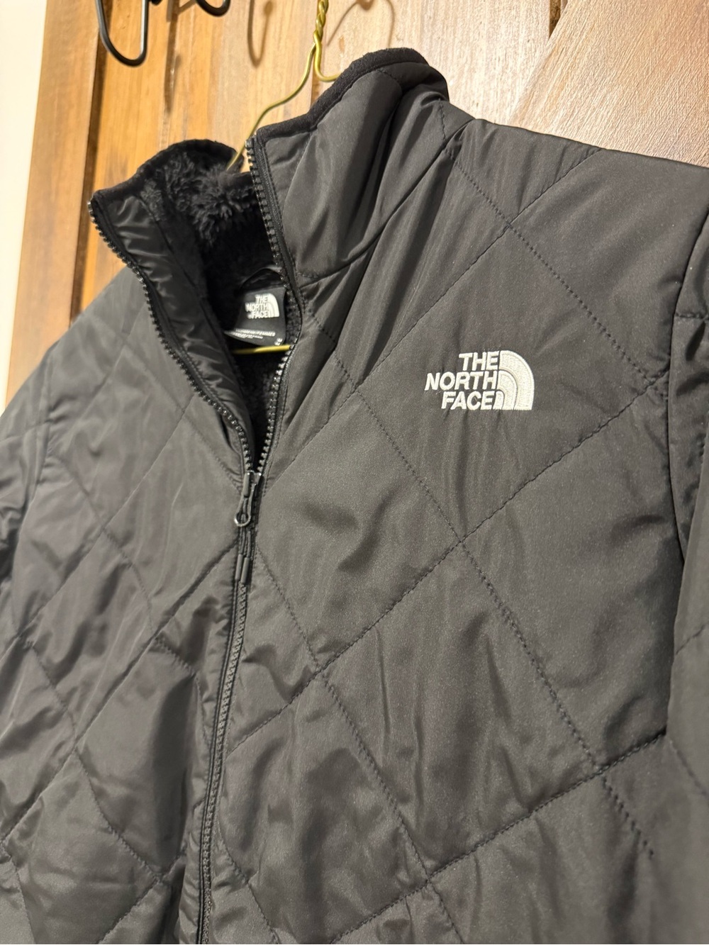 Womens. The North Face Black Quilted Jacket with fuzzy insides